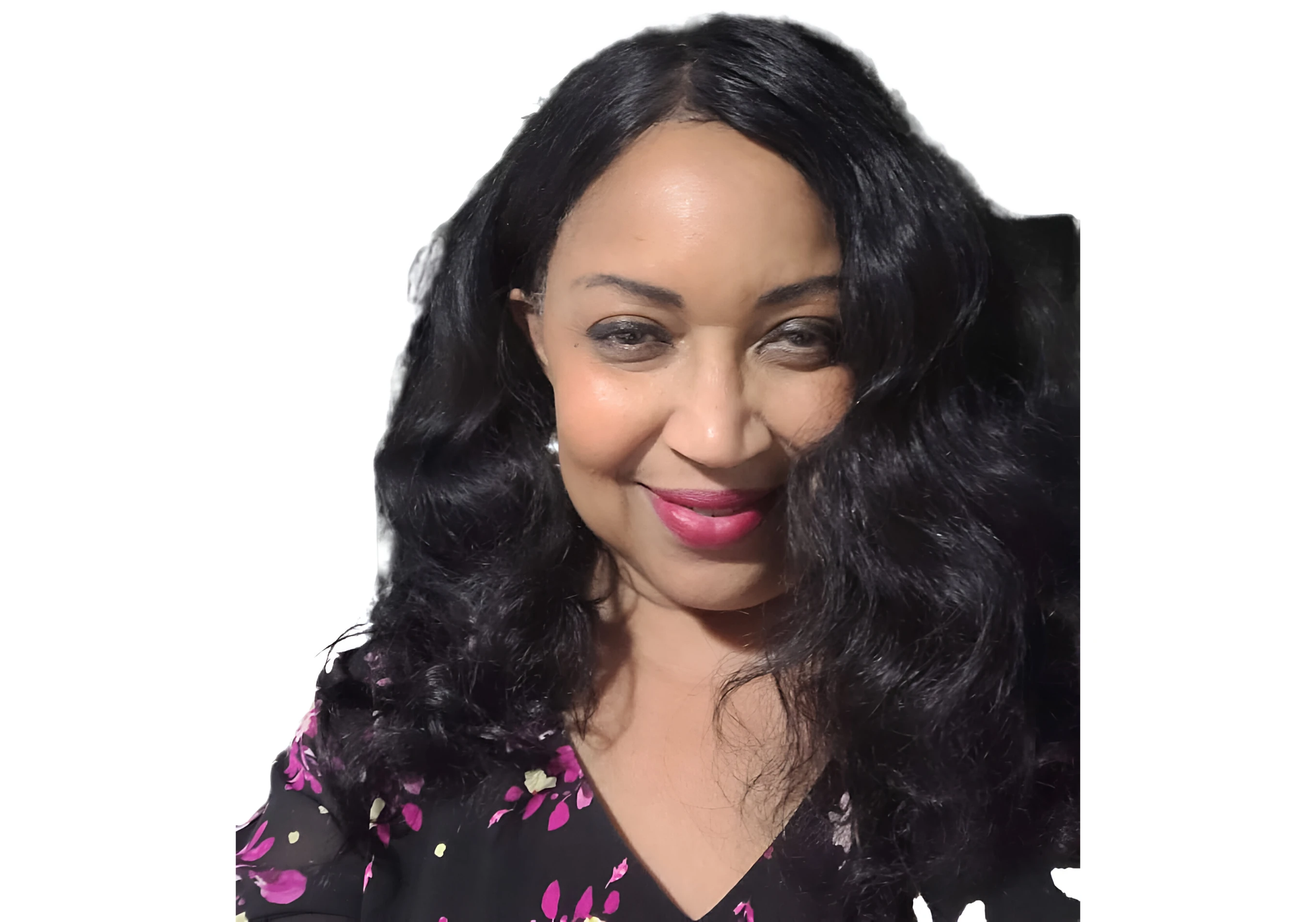 A woman with long black hair wearing a floral shirt.